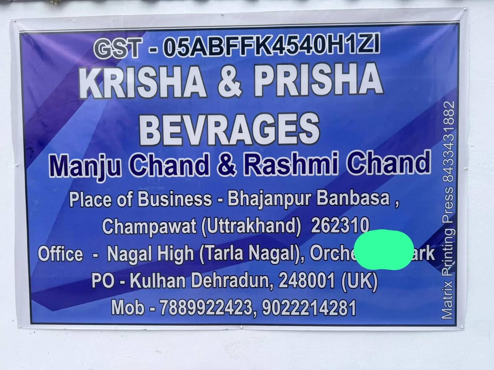 Krisha and Prisha Beverages business board with GST and contact details